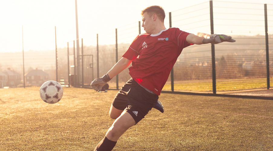 Goal keeper kicking ball