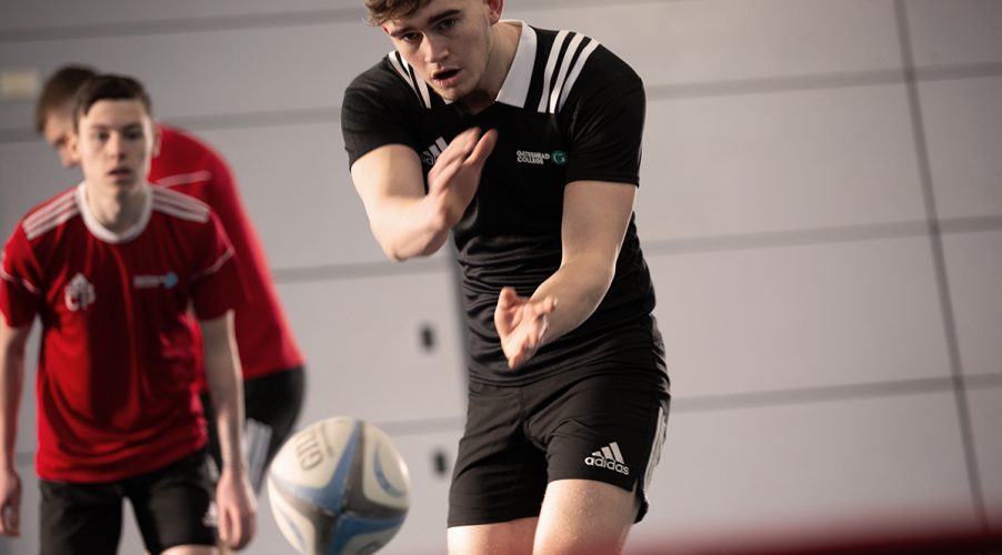 Men's Rugby players throwing ball