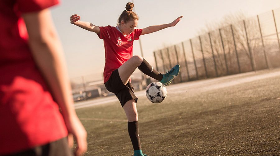 Women's football Academy player practicing
