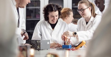 group of science students performing experiment