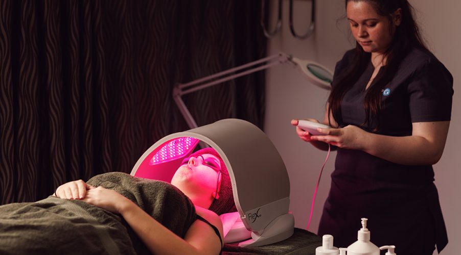 Client recieving LED light therapy facial