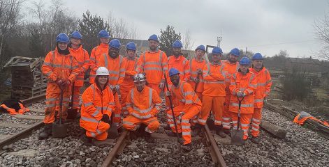 Large ground of rail students in orange high vis jackets