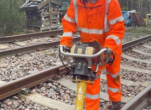 Rail student working with machinery