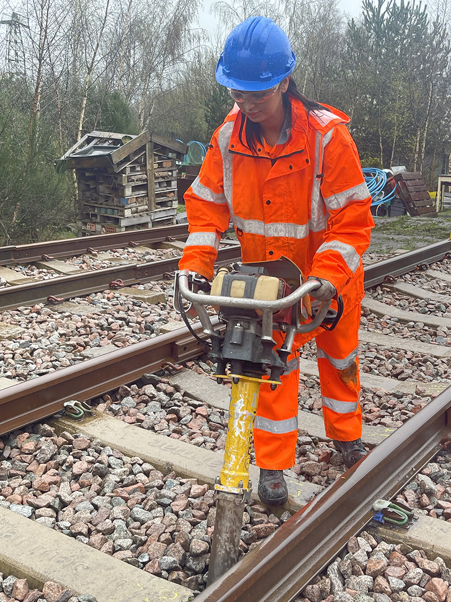 Rail student working with machinery