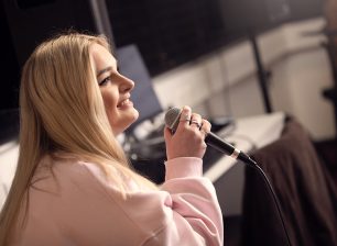 Singer with microphone from the side