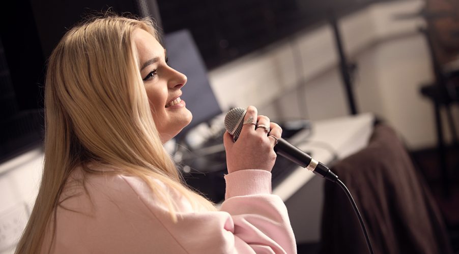 Singer with microphone from the side