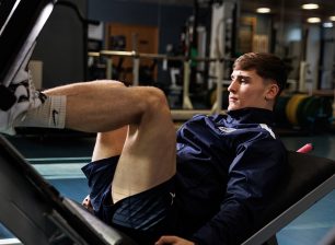 Student on weight machine