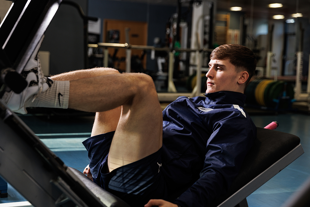 Student on weight machine