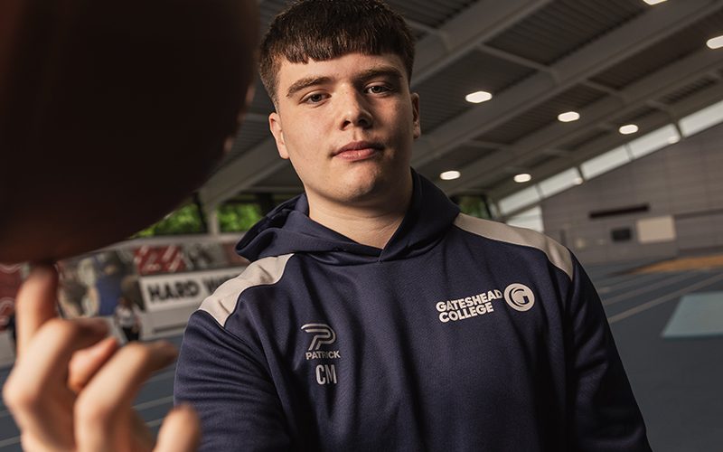 Basketball player spinning ball on finger