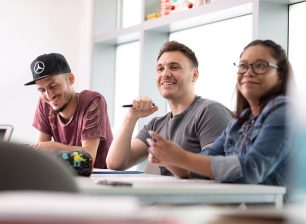Three ESOL students studying in a classroom