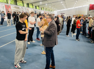 Groups of students and employers talking