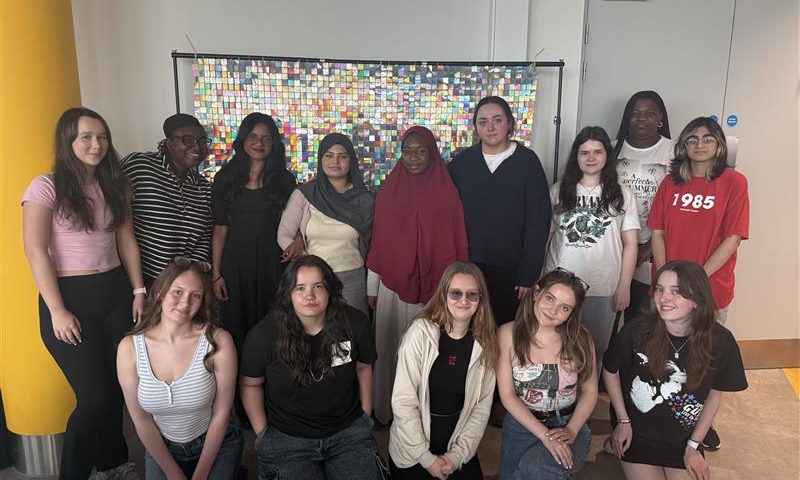 A group of girls standing in a room