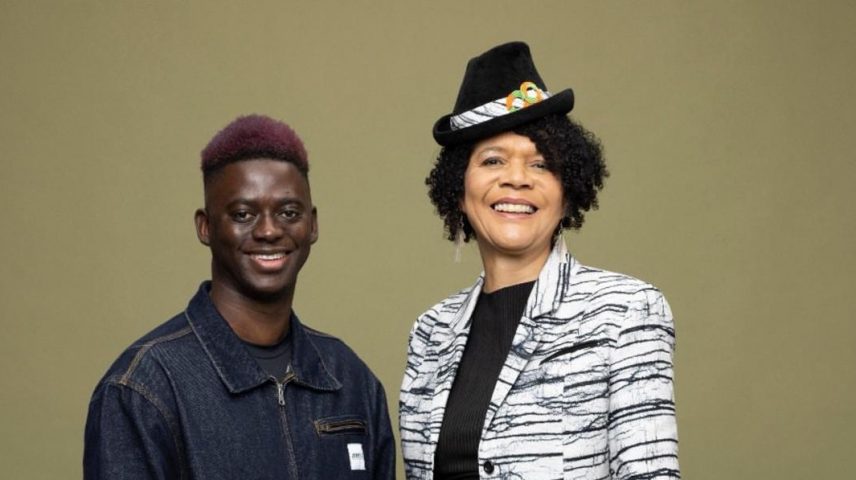 A man and lady standing next to each other.