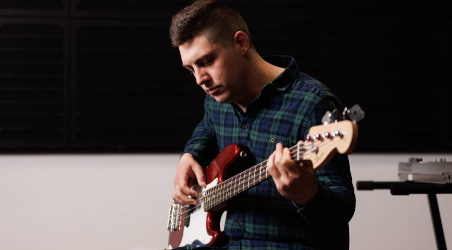 HE music student - playing guitar