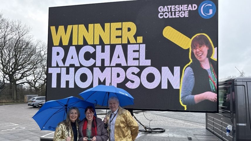 three people standing infront of a Van that says WINNER RACHAEL THOMPSON