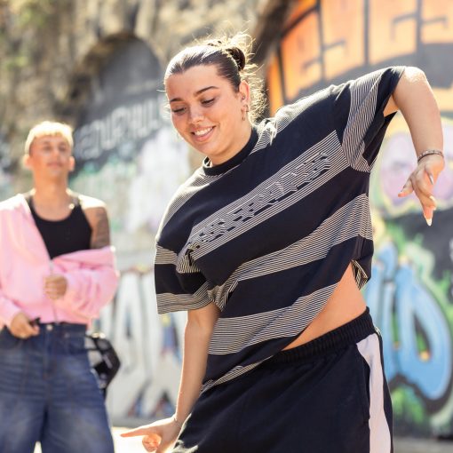 Girl dancing wearing striped top