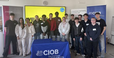 A group of students standing in a room.