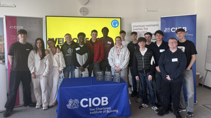 A group of students standing in a room.