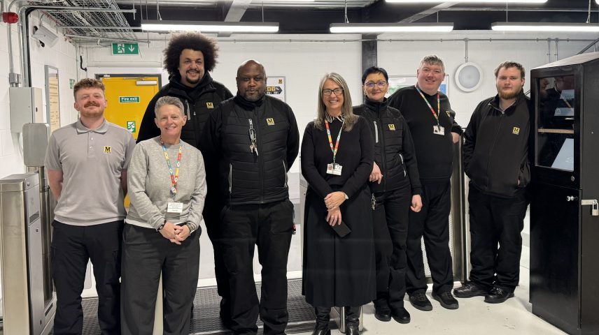 A group of Nexus staff standing in their head office.